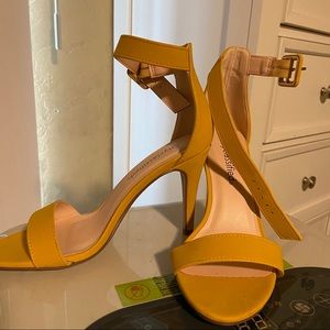 Open toed side buckle heels